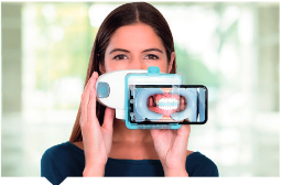 A Girl holding smile scan dental device